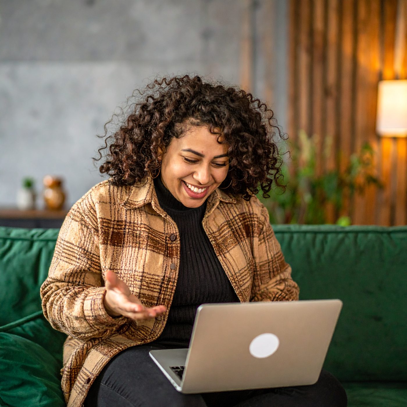 A host managing her event on a laptop