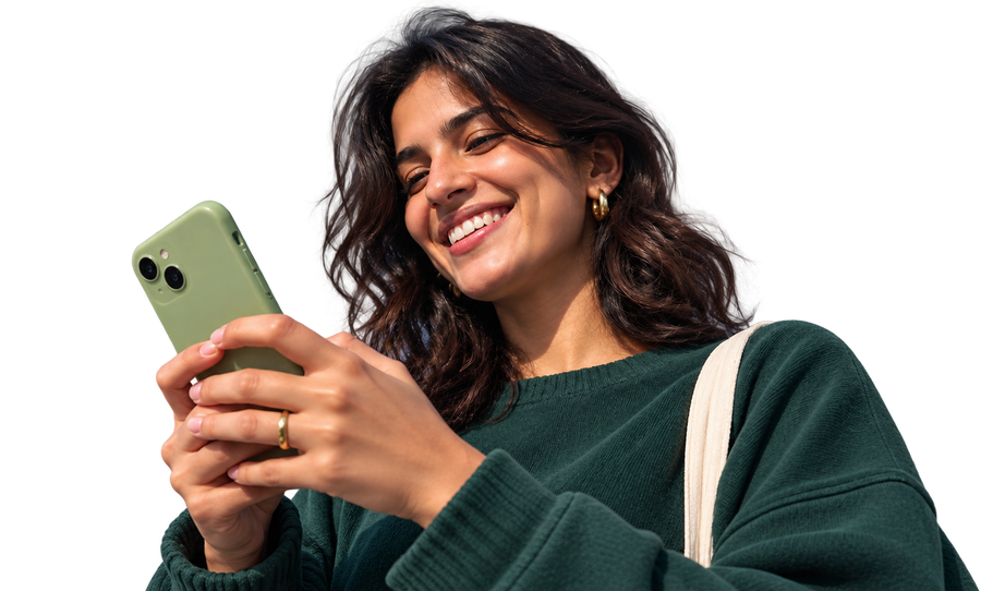 A woman smiling at the Tribl app on her phone
